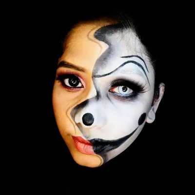 This two-faced illusion makeup is a personal favorite, demonstrating the power of makeup to transform and tell a story. The sharp contrast between the glam and the grotesque is perfect for avant-garde projects.