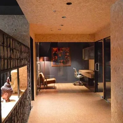 This is the Genesis Office, where I transformed a rented space into a contemporary workplace. I used a material palette of cork, oak, and raw pressed board to imbue the interior with an almost meditative quality.