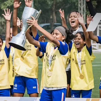 The pure joy of victory. This is what we work for. Our U15 girls team celebrating their championship win at the Reliance Foundation Young Champs Football Cup, holding the trophy high.