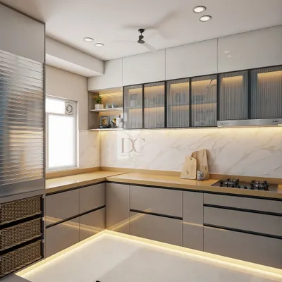 This L-shaped modular kitchen is designed for maximum efficiency. We used high-gloss grey laminate for the cabinets, a marble-finish backsplash, and fluted glass shutters on the upper cabinets for a modern, high-end look.