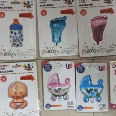 I have a wide variety of themed foil balloons. This collection shows some popular options for baby showers, including 'It's a Boy' milk bottles, baby feet, and strollers in both pink and blue.