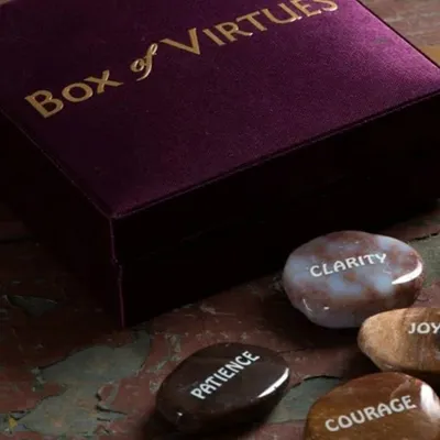Our 'Box of Virtues' has been one of our most loved gifts. It contains seven natural stones, each printed with a virtue like 'Clarity', 'Patience', and 'Courage' to serve as a focus point for your day.