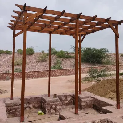 The completed Thermopine wood pergola at Surpura Dam, Jodhpur. Its simple, strong lines and warm wood tones complement the natural, rustic surroundings.