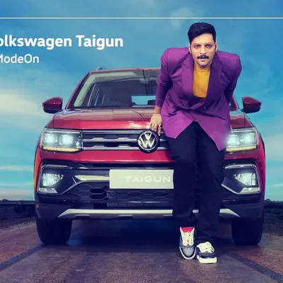 A commercial shoot for the Volkswagen Taigun featuring actor Ali Fazal. This shot combines the star power of the celebrity with the product, creating an aspirational image for the #HustleModeOn campaign.