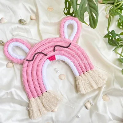 How sweet is this sleepy bunny rainbow? I love adding cute little details like ears to my macrame rainbows to give them extra personality. This piece is perfect for a soft, dreamy nursery theme.