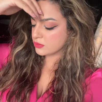 Just a casual selfie moment. A simple look with soft eye makeup, a sharp wing, and a pop of color on the lips.