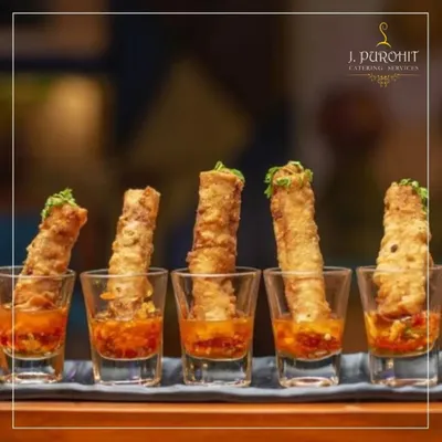 I love creating fusion appetizers like these crispy spring rolls served in shot glasses with a sweet chili dipping sauce. This modern presentation is both stylish and convenient for guests.