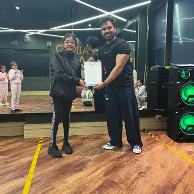 We are thrilled to celebrate our very first graduating cohort from the Jazz Dance Certification program. Here, a student receives her certificate, marking a huge milestone in her dance journey.