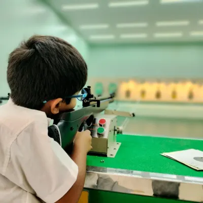 A young student from Greenwood Bannerghatta takes aim, demonstrating incredible focus. Our school programs emphasize proper technique and a steady mindset from an early age, laying the foundation for future champions.