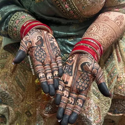 The result of natural henna and proper aftercare is this stunningly deep, blackish-maroon stain. The peacock and elephant motifs look incredibly bold and beautiful.