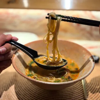 This is what it's all about for us. Seeing our handmade ramen bowl, crafted with care in our studio, being used to enjoy a delicious meal. This one features our popular Shino glaze.