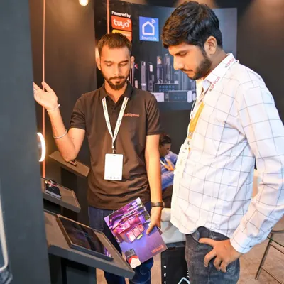 Here I am at the Smart Home Expo 2024, demonstrating the capabilities of my automation solutions to an interested visitor. I believe in sharing my expertise to help clients make informed decisions.
