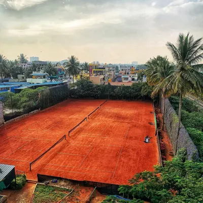 The view from above our courts. This is where the action happens, set against the backdrop of Bangalore's greenery and city life.