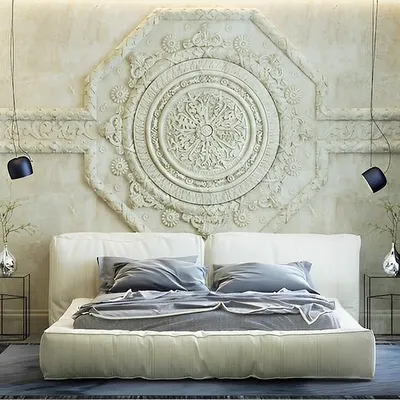 An example of our work in bedroom design. This space features a stunning, large-scale carved mandala as a headboard wall, creating a dramatic and serene focal point. This demonstrates our ability to carry a theme of intricate, artistic design throughout the entire home.