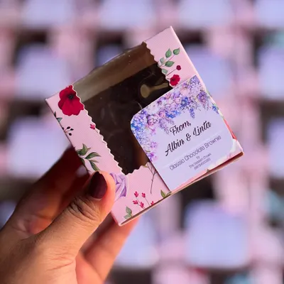 My classic chocolate brownies make for wonderful return favors. Here's a single brownie packed in a custom-labeled floral box for a wedding event.