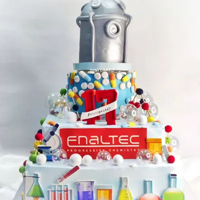 A massive, custom-themed cake for the 17th anniversary of a pharmaceutical company. This huge creation featured a rotating reactor on top and was full of edible scientific details.