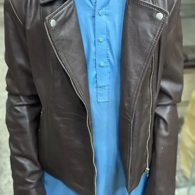 This men's biker jacket in a rich dark brown leather is one of my popular finds from Karachi. The asymmetrical zip and snap button collar give it a classic, cool look.