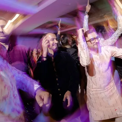 This is what a trippy sangeet looks like. I use slow shutter speeds and zoom bursts to create a motion blur effect that captures the wild energy of the dance floor.