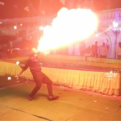 This is the art of performance bartending. Here, I am demonstrating an advanced fire breathing technique during a live event, a skill I teach to experienced students with a focus on safety and maximum visual impact.
