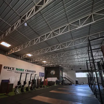 A view of our training floor, equipped with everything needed for CrossFit, Olympic weightlifting, and gymnastics. The open layout provides ample space for group classes and individual skill work in a clean and organized setting.