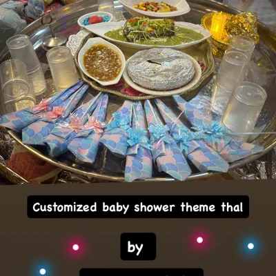 A beautifully customized baby shower theme thal. We love adding personal touches to your celebrations, from the menu to the decor, making your special moments even more memorable.