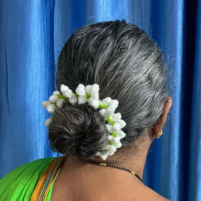 A close-up of the beautiful white crochet gajra I made for my Aaji. It looks so elegant in her hair bun, just like traditional jasmine flowers, but these will last forever.