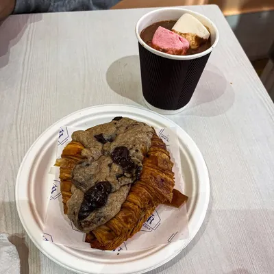 The perfect pair for a cozy evening. Our viral Crookie served alongside a cup of thick hot chocolate topped with marshmallows.