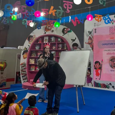 On stage at the World Book Fair 2025, sketching for an audience of enthusiastic students. It was a joy to share my art with them.