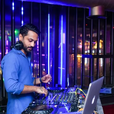 Focused on the mix during my Thursday night set at BOHO. I use industry-standard Pioneer DJ gear to ensure a high-quality, seamless musical journey for the audience.