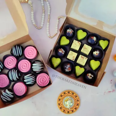Two of my favourite assorted chocolate boxes, side by side. On the left, a playful mix of Bubblegum and Oreo Crunch. On the right, a desi fusion box with Paan Delight, Rasmalai Pistachio, and Almond Crackle.
