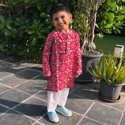Dapper and full of joy. This striking red Patola print kurta is crafted from soft cotton, making it perfect for keeping your little guy active and carefree during any festival.