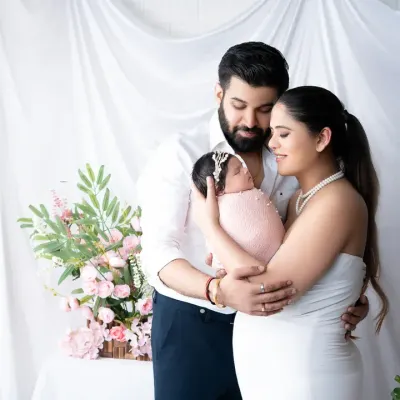 Welcoming their newborn daughter with a tender family embrace. This bright and airy newborn family portrait captures the pure love and joy of the first few days as a new family.