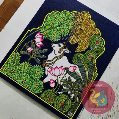 The final version of my Pichwai Cow painting, a showstopper piece for the year. This 12x14 inch artwork features a serene cow amidst a lush garden of lotuses and banana trees, set against a deep blue background, capturing the essence of Nathdwara.
