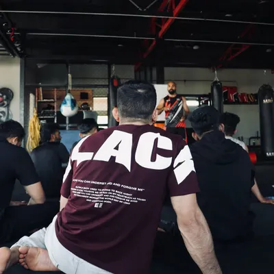 The seminar begins. We gather as a team to understand the fundamentals before we put them into practice. Everyone is here to learn and grow as a future MMA coach.