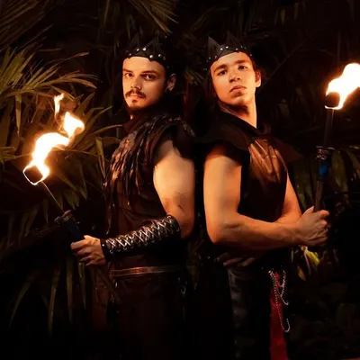 A portrait of our "two brothers" duo act. Their coordinated look and intense presence promise a powerful and epic synchronized fire show.