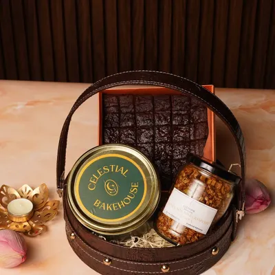 Our Raksha Bandhan Gift Basket, filled with eggless brownies, handcrafted granola, and choco-chunk cookies, all packed in a stylish leatherette basket.