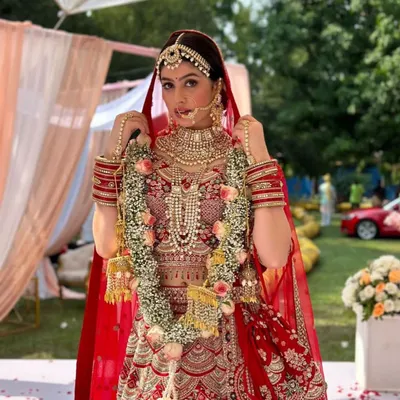 I styled this stunningly intricate Indian bridal look for a photoshoot with actress Riva Arora. The design features a heavily embroidered red lehenga, layered necklaces, a maang tikka, and a traditional red dupatta.