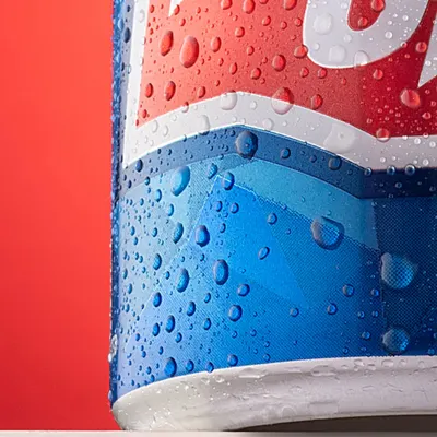 A macro shot of the Thums Up can, focusing on the perfectly formed condensation. This level of detail shows the technical skill involved in creating hyper-realistic and appealing beverage photos.