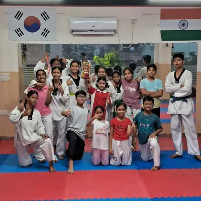 Our team at TaeCross Sports Academy. We foster a supportive community where students of all ages and belt levels train together and motivate each other.