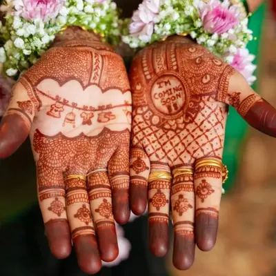 Celebrating a new life with special baby shower mehendi. I designed this with cute motifs like a baby cradle and the sweet message 'I'm Coming Soon' to make the mom-to-be's celebration even more memorable.
