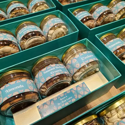 This is a look inside the corporate gift boxes I made for Divine Chairs. The boxes were filled with jars of premium almonds, cashews, and almond crunch, all featuring custom labels that match the client's branding.