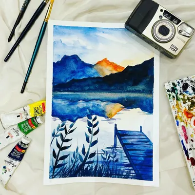 This peaceful lakeside dock painting is a favorite from my online watercolor course. We focus on blending blues and creating realistic reflections in the water.