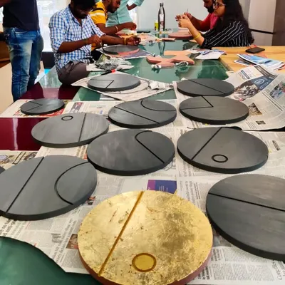 We believe in adding a personal touch to our spaces. These circular wall art pieces were designed and crafted in our own studio for a client's home. Made with wood, vegetable dyes, and gold and silver leaf, they represent the phases of the moon and add a layer of bespoke artistry to the interior.