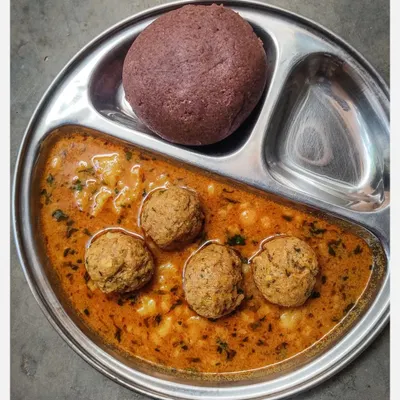 The perfect pairing: my Khaima Unde Saaru with a hot, steaming Ragi Mudde. The earthy flavour of the finger millet ball is the ideal vessel to soak up the rich, spicy gravy of the minced lamb meatballs. This is soul food, the traditional way.