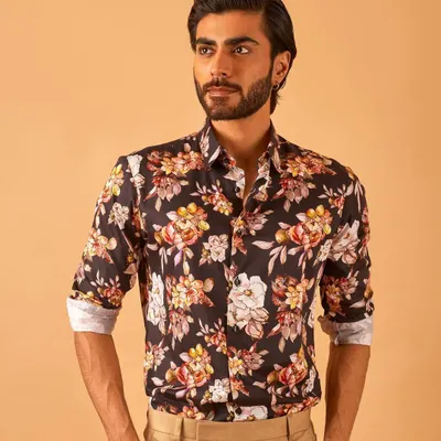 A bold floral print shirt is a great way to make a statement. We custom-stitch our shirts for a perfect fit, ensuring you look sharp whether you wear it alone or under a blazer.