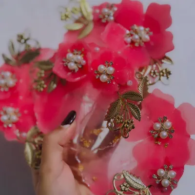 A handful of my custom coin plates, ready for a Milni ceremony. I made these in a bright pink resin, with 3D flowers, pearls, and golden leaf charms. They add such a festive touch to the wedding rituals.