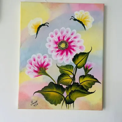 A beautiful floral canvas created using the one-stroke painting technique. In our certified course, you'll learn to paint these delicate flowers and butterflies with ease.