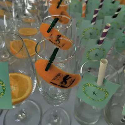 A close-up of my custom-stamped orange peels, adding a unique monogram to the rim of each glass.