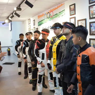 A pre-match briefing in progress. I ensure every shooter understands the rules, procedures, and mental strategy before they step up to the firing line for a competition simulation.