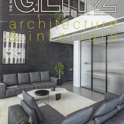 We are proud to have our project, 'The Grey House', featured on the cover of The Neptune Glitz magazine. This image captures the essence of the home's elevated minimalism and the interplay of light and texture in the double-height living space.
